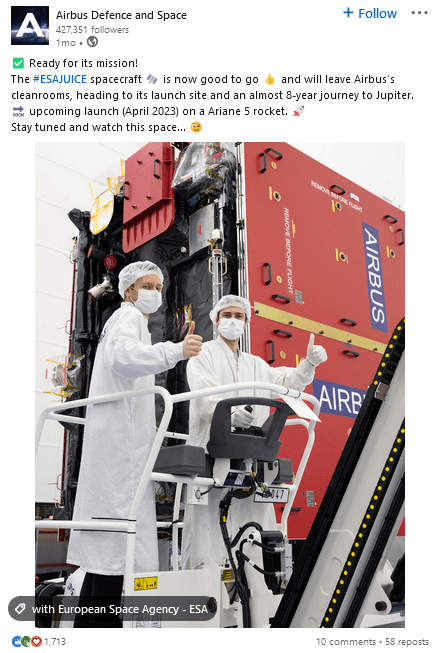 An example of a product launch social media post showing the product in production, in this case engineers working on a spacecraft.